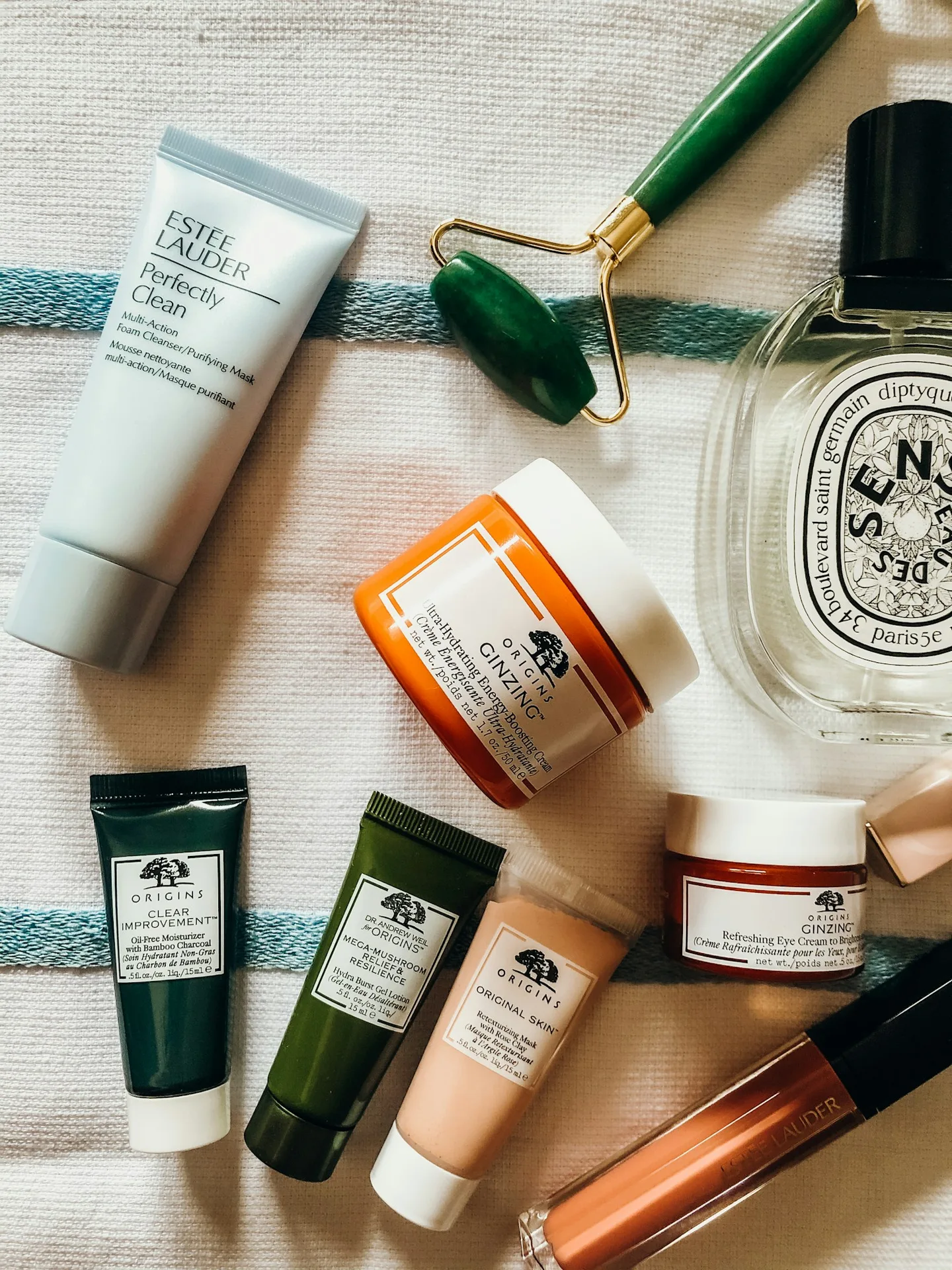 Skincare bottles and jars arranged on a tabletop